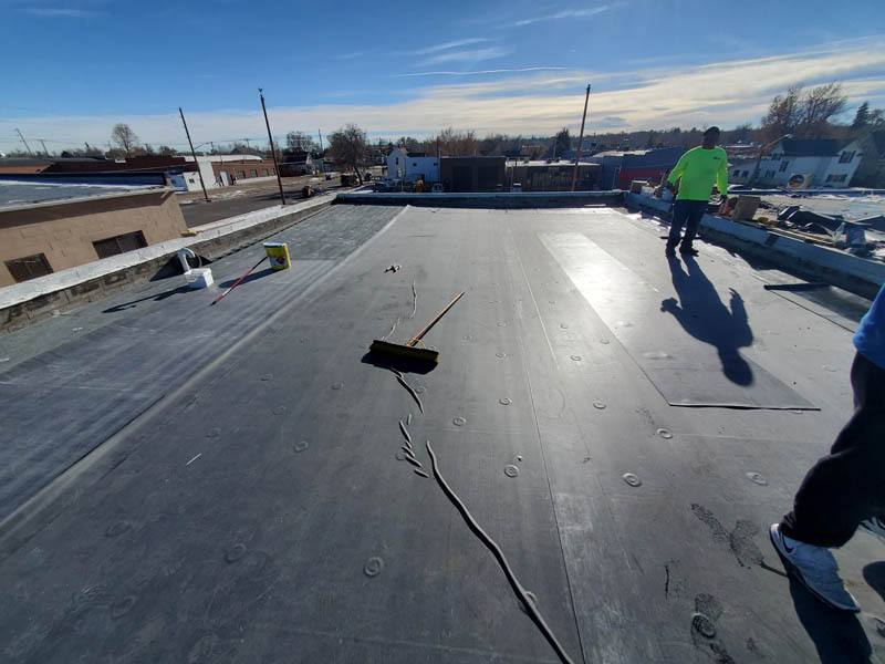 front range commercial roofing contractor installing a flat roof