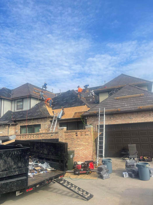 Fredrick roofing company doing an asphalt shingle roof replacement in Fredrick