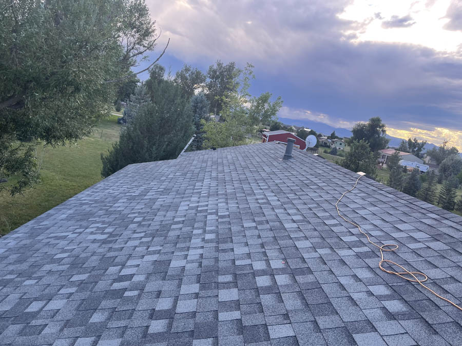Greeley roofer completing a roof replacement in Greely