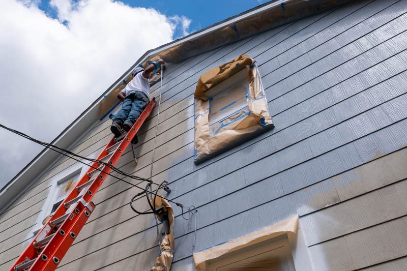 Local exterior painter painting home blue